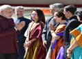 Prime Minister Narendra Modi during an overseas visit, greeting members of the Indian diplomatic and community delegation upon arrival. (File Photo)