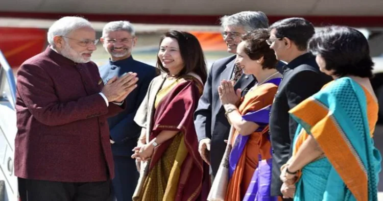Prime Minister Narendra Modi during an overseas visit, greeting members of the Indian diplomatic and community delegation upon arrival. (File Photo)