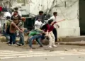 New Delhi, Jul 20 (ANI): Protesters seen pelting stones at Delhi Police during CJP protest at Connaught Place, in New Delhi on Monday. (Delhi Police/ANI Video Grab)