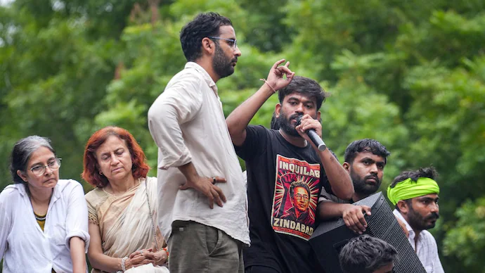 Cockroach Janata Party (CJP) founder Abhijeet Dipke speaks following a protest