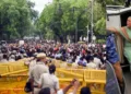 (Left) Protesters at Jantar Mantar (Right) Mana sitting in a police van