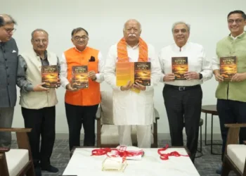 Tarun Vijay presents copy of his book 'Saffron Surge' to RSS Sarsanghchalak Dr Mohan Bhagwat
