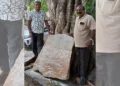 History researcher M Narendra (Left) and Epigraphist K Dhanpal (Right) with the newly discovered 1750 inscription at Dibburu village in Hesaraghatta Hobli