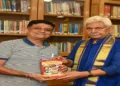 Singapore-based international journalist Sameer Mohindru seen presenting a book to J&K Governor Manoj Sinha during a courtesy call meeting at Lok Bhawan on July 6.