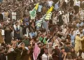 Supporters of the Joint Awami Action Committee (JAAC) gather as they shout slogans during a week-long protest in Rawalakot
