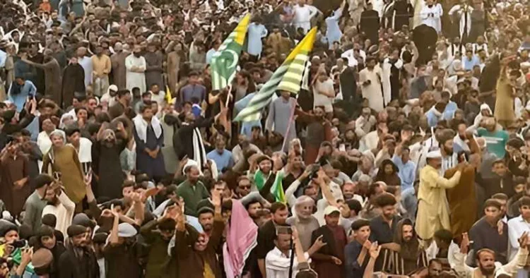 Supporters of the Joint Awami Action Committee (JAAC) gather as they shout slogans during a week-long protest in Rawalakot