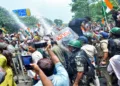 Ranchi, Aug 10 (ANI): Police use water cannons at protesters during students' march towards Jharkhand Assembly to protest against the government over alleged JPSC and JSSC-CGL examination paper leak, in Ranchi on Monday. (ANI Photo)