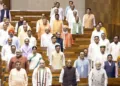 New Delhi, Aug 13 (ANI): Prime Minister Narendra Modi stands for 'Vande Mataram' before the proceedings of the Lok Sabha during the Monsoon Session of Parliament, in New Delhi on Thursday. Union Ministers Amit Shah, Rajnath Singh, Nitin Gadkari, Kiren Rijiju, Giriraj Singh, and Pralhad Joshi; Union MoS Jitendra Singh; and Union MoS (I/C) Arjun Ram Meghwal present. (Sansad TV/ANI Video Grab)