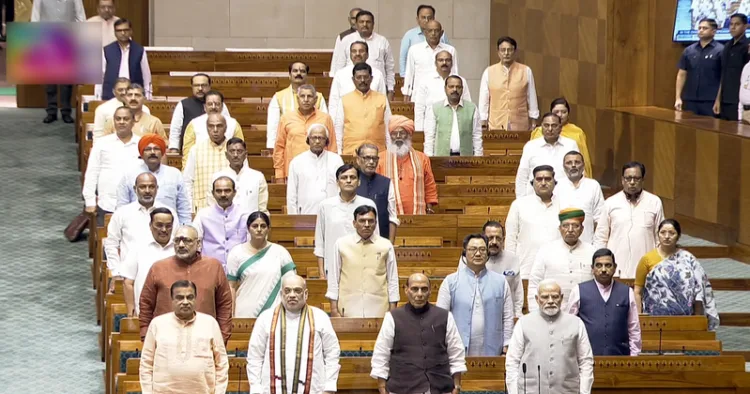New Delhi, Aug 13 (ANI): Prime Minister Narendra Modi stands for 'Vande Mataram' before the proceedings of the Lok Sabha during the Monsoon Session of Parliament, in New Delhi on Thursday. Union Ministers Amit Shah, Rajnath Singh, Nitin Gadkari, Kiren Rijiju, Giriraj Singh, and Pralhad Joshi; Union MoS Jitendra Singh; and Union MoS (I/C) Arjun Ram Meghwal present. (Sansad TV/ANI Video Grab)