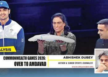 President of the Indian Olympic Association President P. T. Usha holds the Commonwealth Games flag alongside Gujarat Deputy Chief Minister Harsh Sanghavi and Neeraj Chopra during the closing ceremony of the Commonwealth Games 2026 at the OVO Hydro in Glasgow