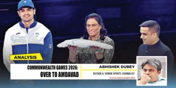 President of the Indian Olympic Association President P. T. Usha holds the Commonwealth Games flag alongside Gujarat Deputy Chief Minister Harsh Sanghavi and Neeraj Chopra during the closing ceremony of the Commonwealth Games 2026 at the OVO Hydro in Glasgow