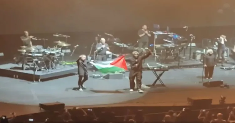 British band Massive Attack displaying Palestinian flag at a concert in Singapore