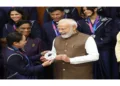 OM Modi with the winning contingent of the Commonwealth Games team