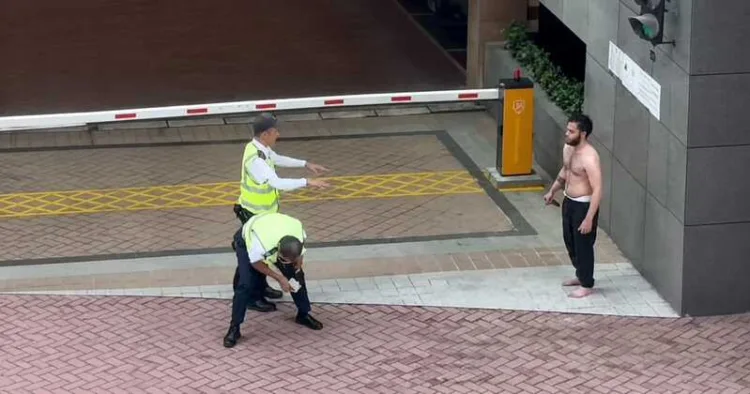 Bangladeshi migrant Khan confronts security guards during the knife attack at Baguio Villa in Hong Kong