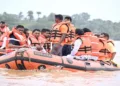 Odisha Chief Minister Mohan Charan Majhi, accompanied by other ministers, surveys flood-affected areas by boat and motorcycle to assess the situation firsthand