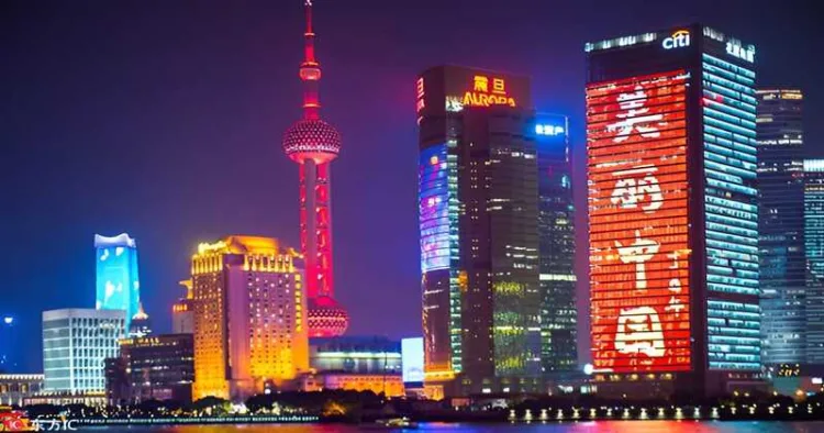 A night view of the Bund with the Oriental Pearl TV Tower and other skyscrapers in Pudong, Shanghai, China