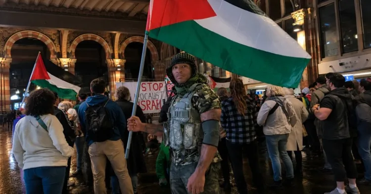Dutch TikTokker Angelo Bryson, known as Superhuman Unchained, at a pro-Palestine protest.