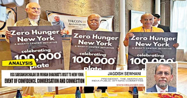 Sarsanghchalak Mohan Bhagwat visited ISKCON in New York on August 28. He poses for a picture holding a placard for the "Zero Hunger New York" initiative by the Bhakti Centre. Minister of Communications and Governing Body Commissioner of ISKCON, Anuttama Dasa (L) also present