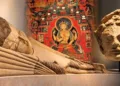 (Left foreground) 12-metre reclining Buddha; (Middle) Buddhist Mural; (Right) Buddha head in Ajina-Tepa, Tajikistan.