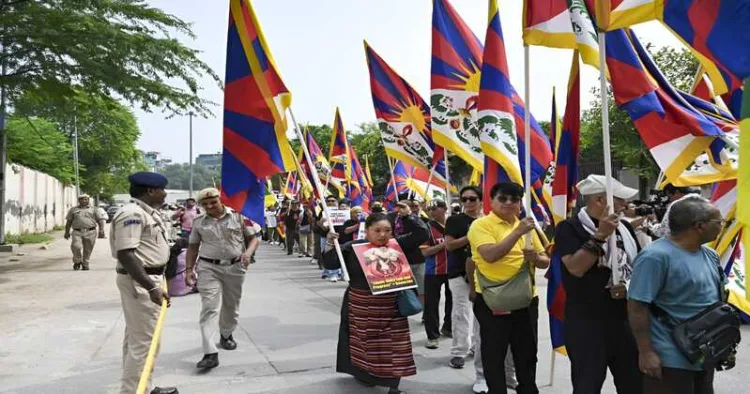 Members of the Tibetan community take part in a protest march against Chinese President Xi Jinping’s visit to India in New Delhi on September 11