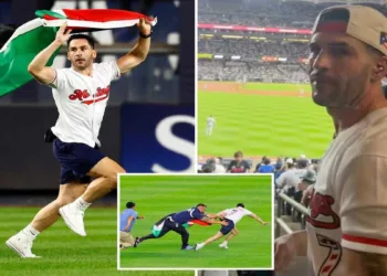 Kelly Marcucci being tackled by security after running onto the Yankee Stadium field with a Palestinian flag during the Yankees-Mets game on September 11, 2026