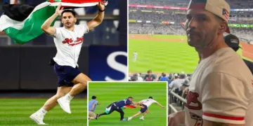 Kelly Marcucci being tackled by security after running onto the Yankee Stadium field with a Palestinian flag during the Yankees-Mets game on September 11, 2026