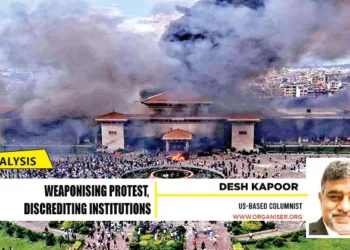 Protesters at the Parliament building in Kathmandu, Nepal, after it was set on fire, in September, 2025