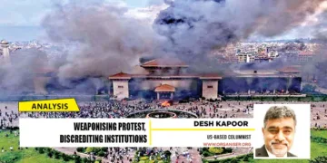 Protesters at the Parliament building in Kathmandu, Nepal, after it was set on fire, in September, 2025