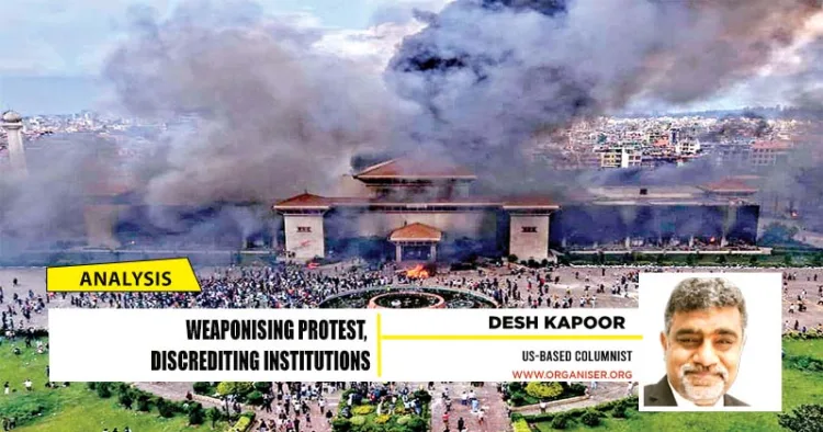 Protesters at the Parliament building in Kathmandu, Nepal, after it was set on fire, in September, 2025