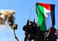 Protesters hold a Palestinian flag on the day French high school and university students attend a demonstration in Strasbourg on October 6,2026.