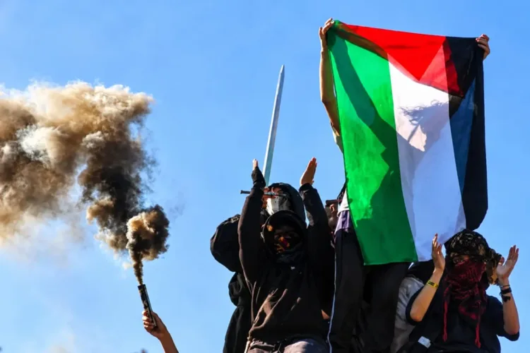 Protesters hold a Palestinian flag on the day French high school and university students attend a demonstration in Strasbourg on October 6,2026.