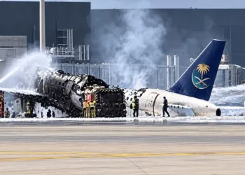 A Saudi Arabian Airlines aircraft burns at Riyadh airport following a Houthi missile attack, amid escalating strikes on Saudi infrastructure