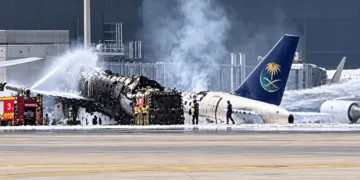 A Saudi Arabian Airlines aircraft burns at Riyadh airport following a Houthi missile attack, amid escalating strikes on Saudi infrastructure