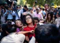 AISA leader Neha Bora has come under the spotlight over claims of calling for women who disagreed with her to be stripped naked and paraded