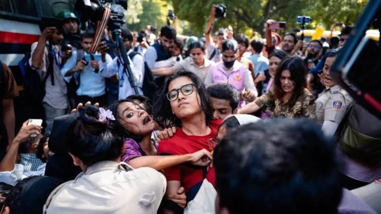 AISA leader Neha Bora has come under the spotlight over claims of calling for women who disagreed with her to be stripped naked and paraded
