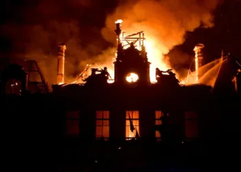 Fire burning and destroying the city hall after a group of individuals forced entry into the building during ongoing riots in Limoges, central France on October 17, 2026