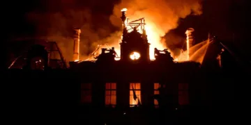 Fire burning and destroying the city hall after a group of individuals forced entry into the building during ongoing riots in Limoges, central France on October 17, 2026