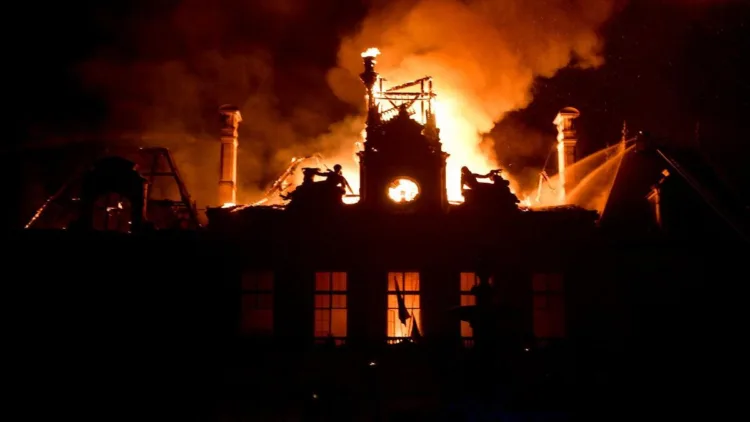 Fire burning and destroying the city hall after a group of individuals forced entry into the building during ongoing riots in Limoges, central France on October 17, 2026