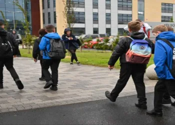 Schoolchildren walk outside an educational institution in Scotland amid heightened security concerns across the United Kingdom.