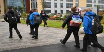 Schoolchildren walk outside an educational institution in Scotland amid heightened security concerns across the United Kingdom.