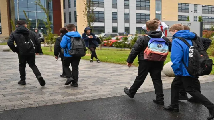 Schoolchildren walk outside an educational institution in Scotland amid heightened security concerns across the United Kingdom.